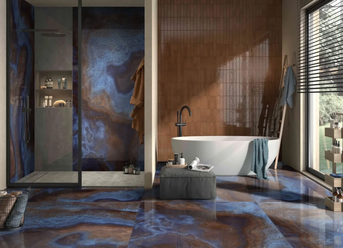 Notice the shower tray is a flatter, plainer material. That isnt an accident